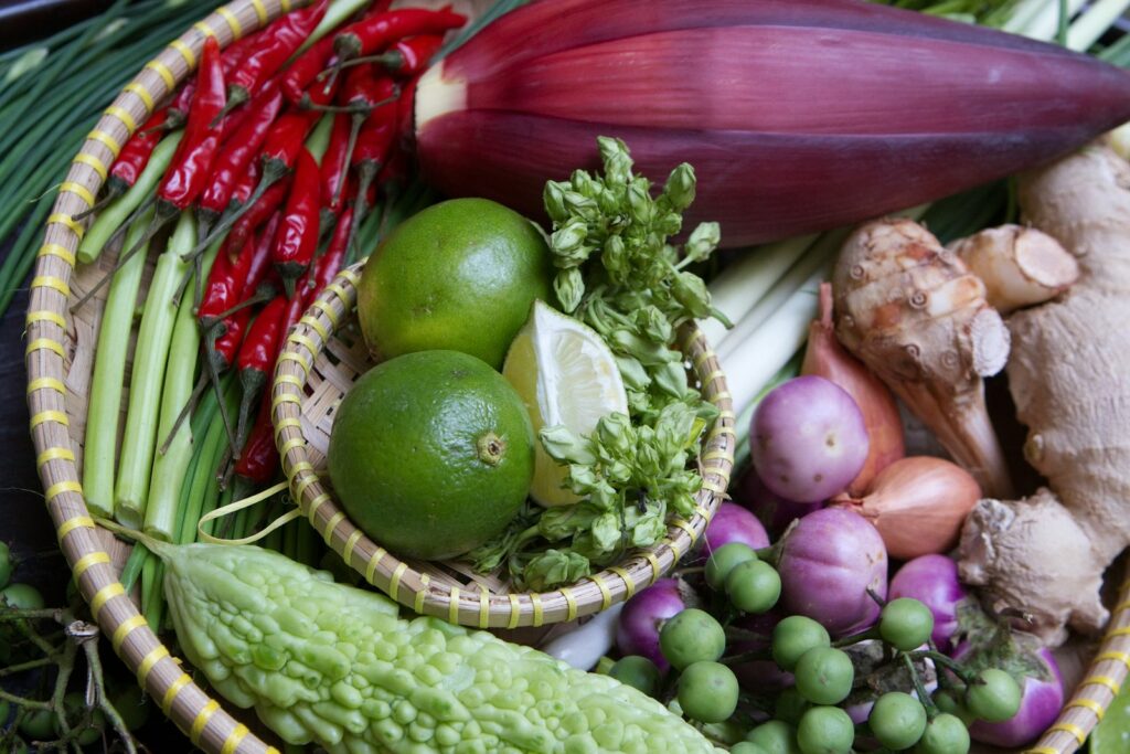 A basket filled with lots of different types of vegetables