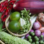 A basket filled with lots of different types of vegetables