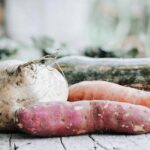 orange carrots on brown wooden table