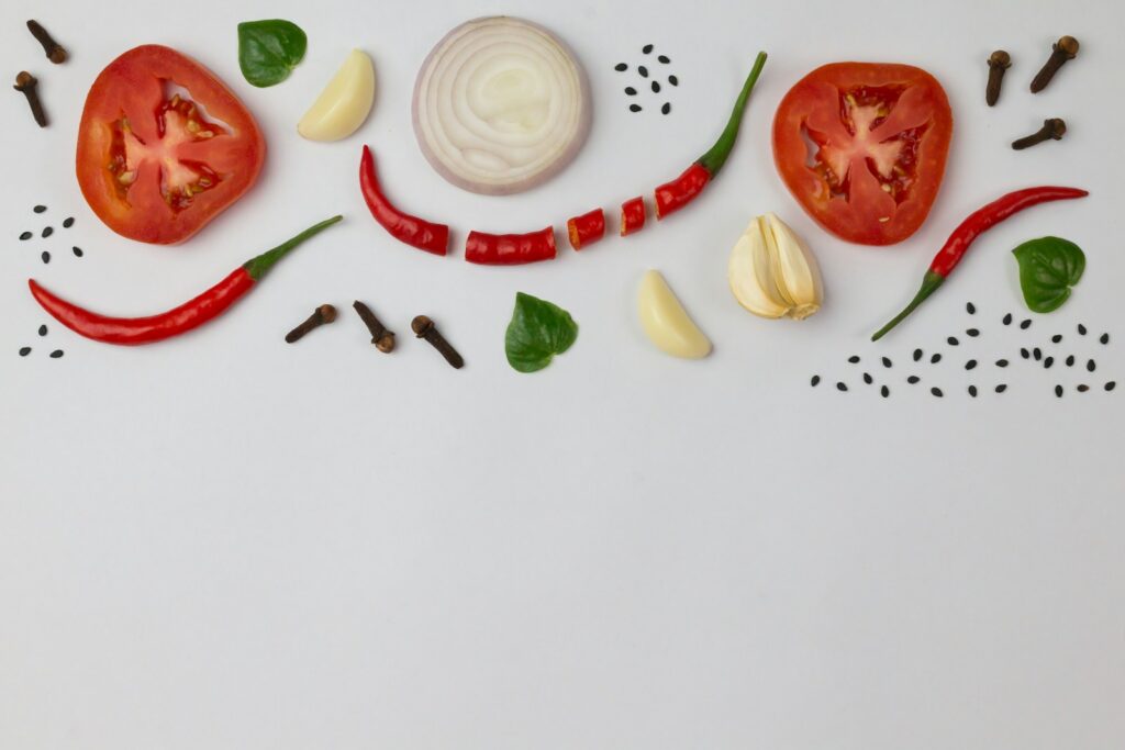 sliced tomato and sliced lemon on white ceramic plate