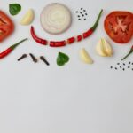sliced tomato and sliced lemon on white ceramic plate