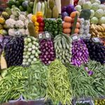 a display in a grocery store filled with lots of vegetables