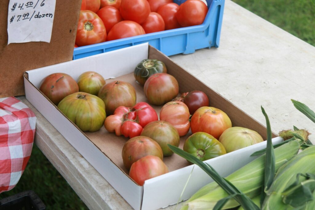 red apples on blue plastic crate