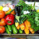 a pile of vegetables sitting on top of a table