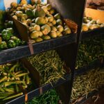 A bunch of vegetables that are on a shelf