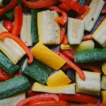 a pile of sliced up vegetables sitting on top of a table