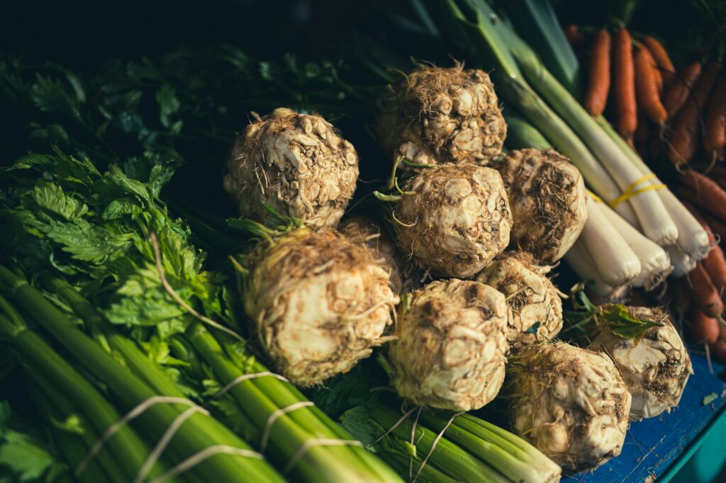 carrots, celery, celery, and other vegetables on display