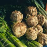 carrots, celery, celery, and other vegetables on display